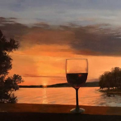 Golden sunset and a glass of wine creates a relaxing watercolor view.